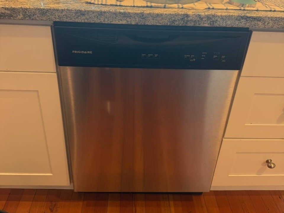 Frigidaire built-in dishwasher under a granite counter