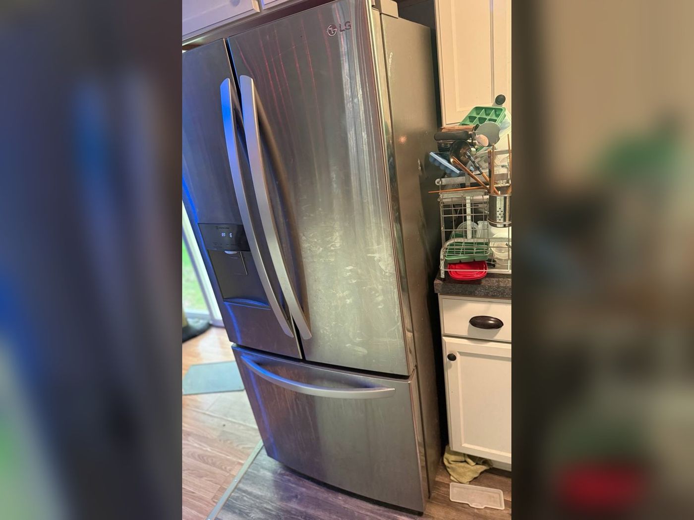 LG French-door refrigerator on a service call